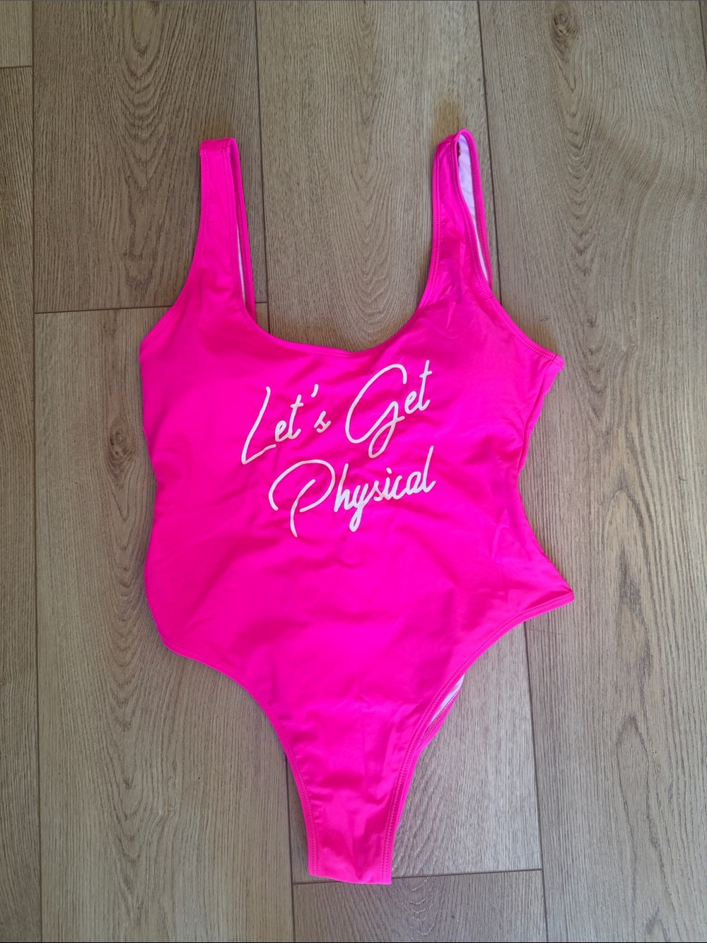 Hot Pink Women's One-Piece Swimsuit with "Let's Get Physical" Script
